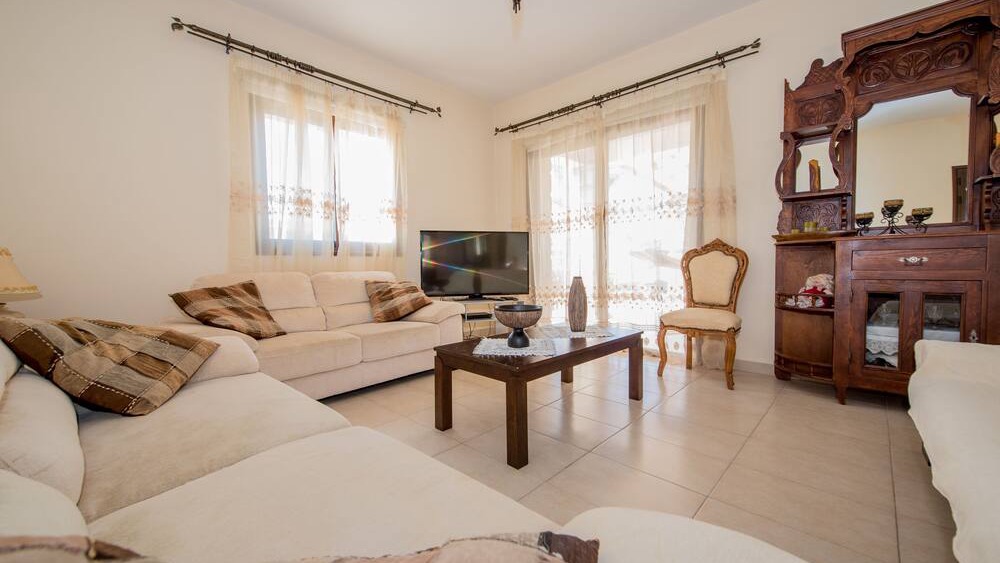 Comfortable cream sofas in the bright living room